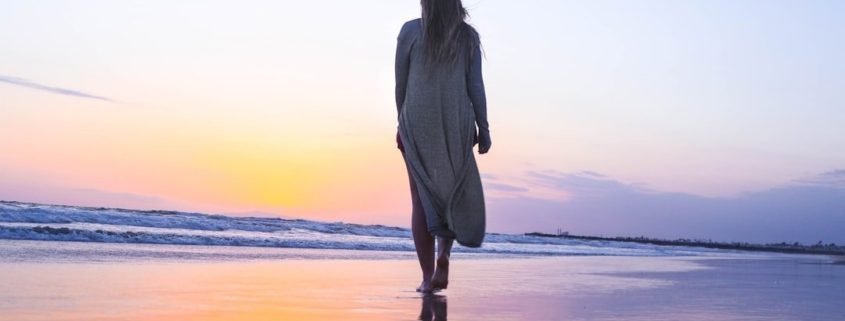 Woman walking on beach Woman walking on beach